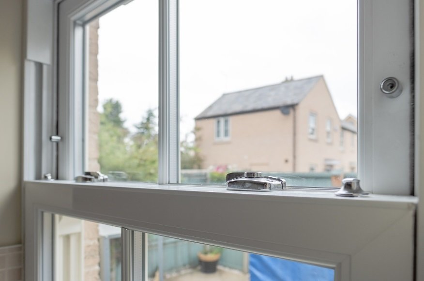 Historic glass and glazing putty in a timber sash window.